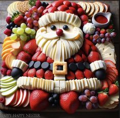 a platter filled with cheese, fruit and vegetables