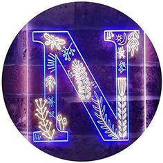 the letter n is lit up with neon lights