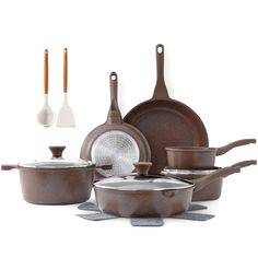 an assortment of brown pots and pans