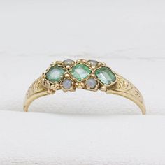 George V 15ct yellow gold Ring set with emerald and split pearls, Marked Birmingham 1921 JP Size Q - Can be resized Classic Green Multi-stone Emerald Ring, Victorian Emerald Ring In Yellow Gold Stamped 14k, Antique Emerald Ring In Stamped 14k Yellow Gold, Victorian Emerald Ring In 14k Yellow Gold, Green Emerald Ring With Rose Cut Diamonds For Anniversary, Anniversary Green Emerald Ring With Rose Cut Diamonds, Victorian Emerald Ring In 14k Gold, Victorian Emerald Ring In Yellow Gold, Antique Emerald Rings With Rose Cut Diamonds