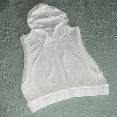 Brand New Never Worn. Banded Tank Top With Hood. Prefect For Swim Cover Up. White Summer Top With Drawstring Hood, White Drawstring Hood Top For Summer, White Drawstring Hooded Top For Summer, Sleeveless Top With Drawstring Hood For Spring, Hooded Top For Summer Loungewear, Summer Hooded Loungewear Tops, Hooded Beach Tops For Spring, White Hooded Tops For Summer, Sleeveless Hoodie With Drawstring For Spring