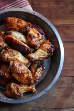 chicken wings in a bowl on a wooden table