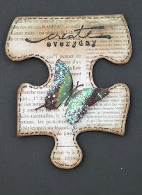 a piece of wood with a butterfly on it's side and the word love is written in cursive writing