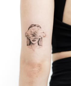 a woman's arm with a tattoo on it