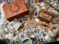 a wooden box sitting on top of a fur covered floor next to some other items