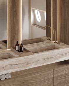 a bathroom with two sinks, mirrors and towels on the counter top next to each other