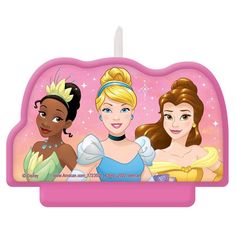 three princesses are standing together in front of a birthday candle