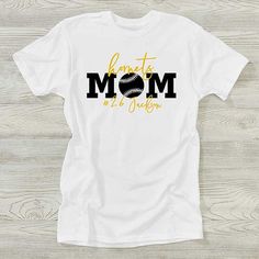 Personalize with sport, 1 line of text above and 1 line of text below "mom"Choose from multiple color combinations   Our Sports Mom Personalized Ladies Shirts will clearly state that she is your #1 fan as she watches you play your favorite sport. Sporty Graphic Print T-shirt For Mother's Day, Sporty Crew Neck T-shirt For Mother's Day, White Sporty T-shirt For Mother's Day, Sporty White T-shirt For Mother's Day, Mother's Day Sports T-shirt With Letter Print, Ladies Shirts, Sports Mom, Ladies T Shirt, Multiple Color