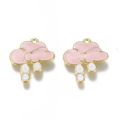 two pink and white flower shaped charms with tears on each side, one in gold plated metal