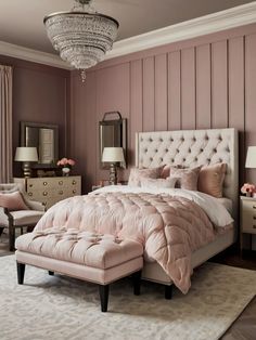 a bedroom with pink walls, white furniture and a chandelier hanging from the ceiling