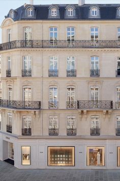 an apartment building with many windows and balconies