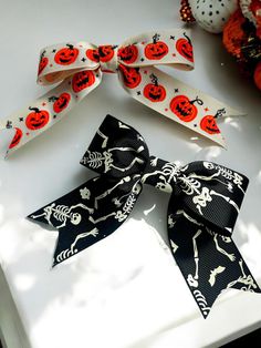 Beautiful handmade hair bows using Halloween, polyester grosgrain ribbon and attached securely to an alligator clip.  Each bow measures approximately 5 inches X 5 inches (including tails) It's a truly beautiful addition to any hairstyle! Skeleton Pumpkin, Halloween Bows, Handmade Hair Bows, Bow Hair, Barrette Clip, Grosgrain Ribbon, Hair Bow, Hair Bows, Skeleton