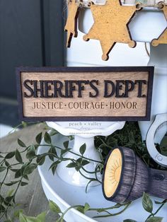 there is a sign that says sheriff's dept justice - courage - honor