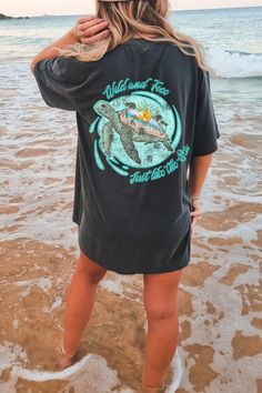 "Wild And Free Just Like The Sea Oversized TShirt, Comfort Colors Tshirt, Graphic Tees For Women, Boho Shirt, Sea Turtle Shirt, Ocean Shirt Whether you're hitting the road for a cross-country adventure or just hanging out with friends, you'll love its comfortable, oversized fit with this Comfort Colors shirt. The mineral wash feel is super soft and perfect for any casual occasion. Rock this tee with your favorite jeans or leggings and you'll look great no matter what. This is a standard unisex size Comfort Colors Tee. For an oversized tee, please size up. If you are looking for an oversized \"T-shirt Dress\" look, we recommend sizing up 2 sizes. Please review the size chart to ensure you receive the fit you want. HOW TO ORDER 1- Select \"Shirt Size\". 2- Select quantity. 3- Click \"Add To Summer Oversized Tee Outfit, Black Screen Print Tops For Beach, Black Screen Print Top For Beach, Camp List, Ocean Shirts, Oversized Tshirt Outfit Summer, Oversized Tee Outfit, Graphic Tshirt Outfit, Sea Turtle Shirt