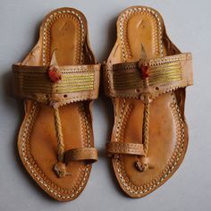 30% OFF on all items and get 10% EXTRA Discount on Purchase THREE or MORE items COUPON CODE-GANPATI . Handmade Jutti closure:- pull on Color:- Tan Material:- Leather Made:- Handmade Sole:- Leather Can Be Personalized:- Yes Transform your footwear collection with the rustic charm of our exquisite Kolhapuri slippers, a fusion of traditional Indian craftsmanship and contemporary style. These handmade, brown leather slides epitomize the essence of authentic Kolhapuri chappals, renowned for their ric Traditional Closed Toe Toe Ring Sandals For Festivals, Festive Open Toe Sandals For Beach, Traditional T-strap Sandals With Round Toe, Festival Sandals With Cutdana And Round Toe, Traditional Toe Ring Sandals For Festivals, Traditional Open Toe Huarache Sandals, Leather Toe Ring Sandals For Festivals, Festival Sandals With Leather Sole And Single Toe Strap, Traditional Sandals With Single Toe Strap For Festive Occasions