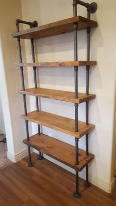 an industrial style shelving unit with four shelves and two pipe pipes on each shelf