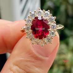 Luxury Oval Ruby Ring With Halo Design, Luxury Red Oval Rings, Luxury Red Ruby Ring With Halo Design, Luxury Ruby Ring With Halo, Luxury Red Halo Ruby Ring, Luxury Red Ruby Ring With Halo, Luxury Red Halo Design Rings, Luxury Red Rings With Halo Design, Fine Jewelry Red Ruby Ring With Halo