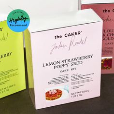 three boxes of lemon strawberry poppy seed cake sitting next to each other on a table