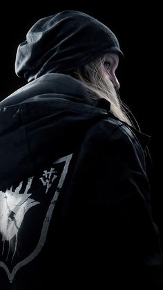 a person wearing a black hoodie with a white wolf on it's back