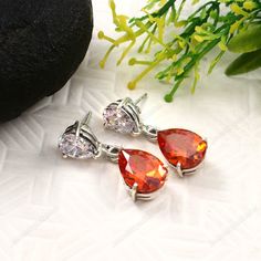 Orange white Topaz gemstone earring/Dangle  Teardrop Large bi-color imperial Orange white Topaz dangling earrings, orange Red topaz drop earrings, gift for her,925 sterling silver,Wow,November April birthstone Gemstone- Orange Topaz-10x14mm  About gemstone- Orange Topaz Orange Topaz is a great stone for stabilizing, strengthening, and healing your emotional body. What is this? Its energy will show you the real meaning of truth, honesty, and forgiveness. It will replace your negativity, fear, and Silver Teardrop Earrings With Prong Setting As Gift, Orange Teardrop Gemstone Earrings, Orange Drop Earrings For Anniversary, Orange Cubic Zirconia Jewelry For Gift, Orange Cubic Zirconia Jewelry Gift, Orange Cubic Zirconia Jewelry As A Gift, Orange Teardrop Anniversary Jewelry, Pear-shaped Orange Jewelry Gift, Orange Pear-shaped Jewelry For Gifts