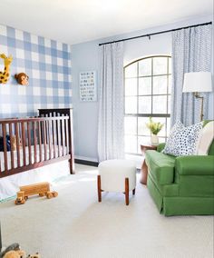 a baby's room is decorated in blue and white checkered wallpapers