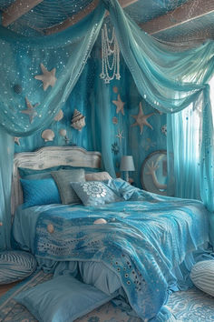 a bedroom decorated in blue and silver with stars on the ceiling, curtains, and bedding