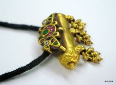 "vintage antique tribal old 22k gold amulet pendant necklace taviz from rajasthan india. nice design made of 22k yellow gold, good for jewelry collection. Note - pendant is filled with wax. Piece is much check pictures carefully for more detail. Height with bells - 3 cm(1.18\") width max.- 3.8 cm(1.5\") weight - 14.5 grams material - 22k yellow gold & original old worn piece." 22k Gold Temple Necklace Pendant For Festivals, Meenakari Pendant Temple Necklace For Puja, Meenakari Temple Necklace Pendant For Puja, Gold Kundan Pendant Temple Necklace, Antique Gold Meenakari Temple Necklace, Antique Gold Temple Necklace With Meenakari, Traditional Yellow Gold Temple Necklace With Pendant, 22k Gold Pendant Temple Necklace For Festivals, Festive 22k Gold Temple Necklace With Pendant