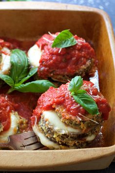 eggplant parmesan stacks with basil on top and the title overlay reads, eggplant parmesan stacks