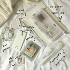 the contents of an electronic device laid out on top of a white sheet with instructions