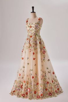 This A-line, full length gown features a fitted bodice with straps, as well as a built-in bra for added comfort. It is made from tulle fabric in a champagne hue and decorated with sequin florals and embroidered flowers. A zip-up back completes the look. Fitted Floor-length Ball Gown With Floral Applique, Sleeveless Floral Applique Prom Gown, Floor-length Tulle Gown With Floral Embroidery, Sleeveless Gown With Floral Applique For Prom, Tulle Ball Gown With Floral Embroidery, Sleeveless Prom Gown With Floral Applique, Floral Embroidered Ball Gown With Fitted Bodice For Gala, Floral Applique Gown With Fitted Bodice For Debutante Ball, Floral Applique Gown For Debutante Ball