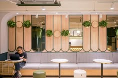 a person sitting at a table in an office