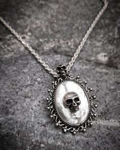 "Victorian Skull White Opal Steampunk Gothic Oxidized Sterling Silver 925 Pendant Necklace on Chain Our beautiful Gothic White Opal Skull Necklace is the perfect finishing touch to your gothic wedding gown. White Opal Skull Gothic pendant will be a hit with your horror-loving friends or anyone who loved a more dark style of jewelry. This is an excellent unique gift for anyone who enjoys Skulls, Halloween, Rockabilly style, Gothic Style, or unique horror artwork. This necklace can be worn with an Punk Style Engraved Necklace For Gift, Punk Style Engraved Jewelry Gift, Silver Punk Style Jewelry Chain, Silver Punk Jewelry With Chain, Punk Style Silver Chain Jewelry, Punk Style Engraved Metal Jewelry, Engraved Punk Style Metal Jewelry, Engraved Metal Punk Jewelry, Gothic Pendant Necklace With Silver Chain