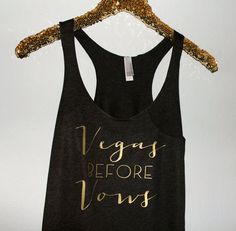 a black tank top that says vegay before you're ugly on it with gold glitter