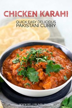 chicken karahi in a bowl with cilantro on the side