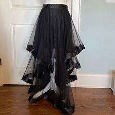 Long Black Layered Tulle Skirt With Satin Ribbon Trim. Lined At The Top. Sheer Bottom. Zips Up In Back. From Venus Size 2 Machine Washable. Floor Length Black Tulle Skirt, Black Tulle Full Skirt, Black Tulle Flared Skirt, Long Black Tulle Skirt, Black Flowy Tulle Maxi Skirt, Luxury Black Tulle Maxi Skirt, Tool Skirt, Black Tulle Skirt, Tulle Skirt Black