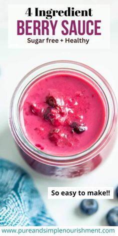 berry sauce in a glass jar with blueberries on the side and text overlay reading 4 ingredient berry sauce sugar free + healthy so easy to make