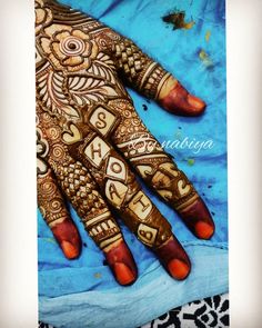 a henna is shown on the palm of someone's hand with numbers painted on it