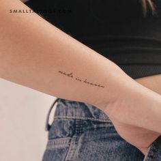 a woman with a small tattoo on her arm