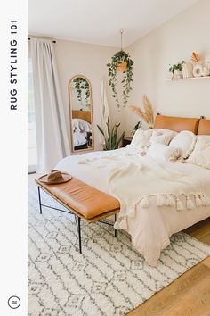 a large bed sitting in a bedroom on top of a wooden floor next to a window