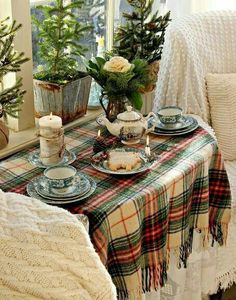 the table is set with dishes and cups