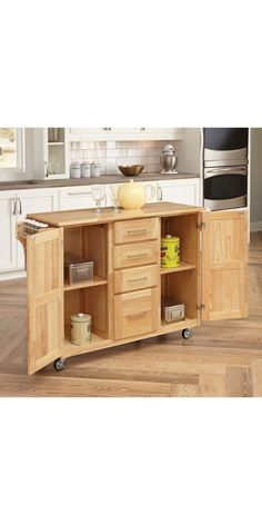 the kitchen island is made from wood and has drawers on each side that are open