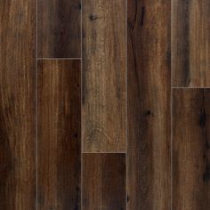 wood flooring with dark brown tones and wooden planks on the bottom half of it