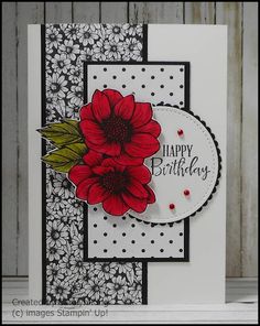 a birthday card with red flowers on it