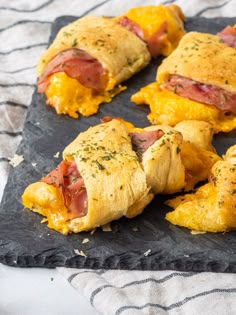 ham and cheese pastries on a black slate platter, ready to be eaten