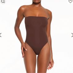 Color: Cocoa Brand New No Longer Sold Comes With Cami Straps As Well Strapless Second-skin Seamless Bodysuit, Seamless Solid Color Bandeau Bodysuit, Chic Strapless Bodysuit With Lined Body, Chic Strapless Bodysuit For Beach, Solid Color Strapless Bodysuit For Swimming, Solid Bandeau Bodysuit For Swimming, Solid Bandeau Bodysuit For Beach, Strapless Solid Color Bodysuit For Swimming, Strapless Stretch Bodysuit For Poolside