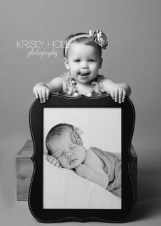 a black and white photo of a baby in a frame