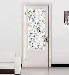 an open door in a white room with black and white wallpaper on the walls