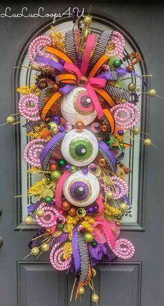 the front door is decorated with an eyeball and candy canes wreath for halloween