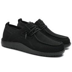 a pair of black men's shoes with mesh detailing on the upper and sides