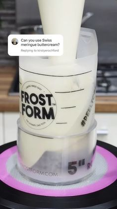 there is a frosting container on top of the counter with an email message above it